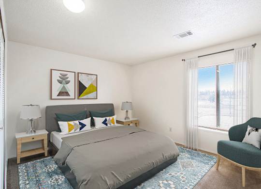 a bedroom with a large window at Seville Apartments, Kalamazoo, MI, 49009