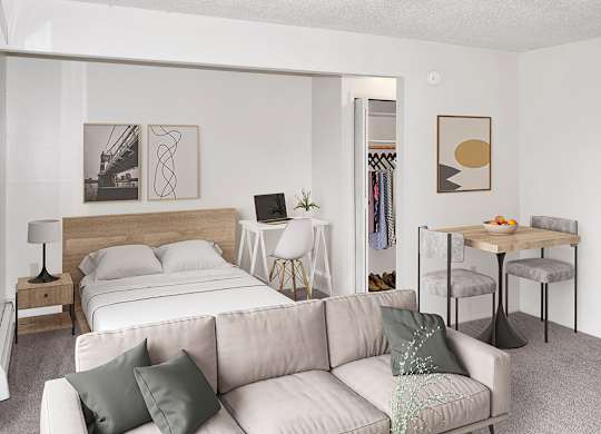 a living room with a sleeping area at Seville Apartments, Kalamazoo, 49009