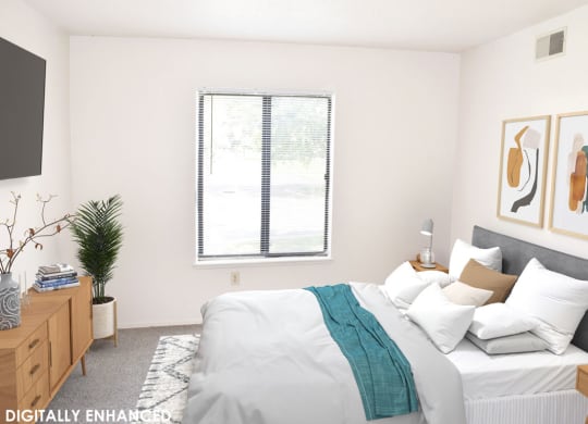 Bedroom with a window in it at Seville Apartments in Kalamazoo, MI 49009