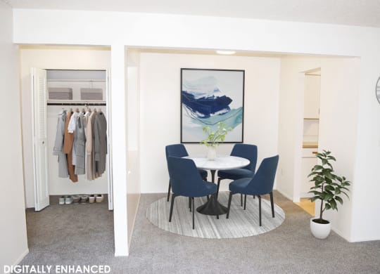Dining room with an entry door to a closet at Seville Apartments in Kalamazoo, MI 49009