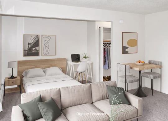 a living room with a sleeping area at Seville Apartments, Kalamazoo, 49009