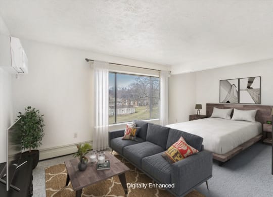 studio living areas with large window at Seville Apartments in Kalamazoo, MI 49009