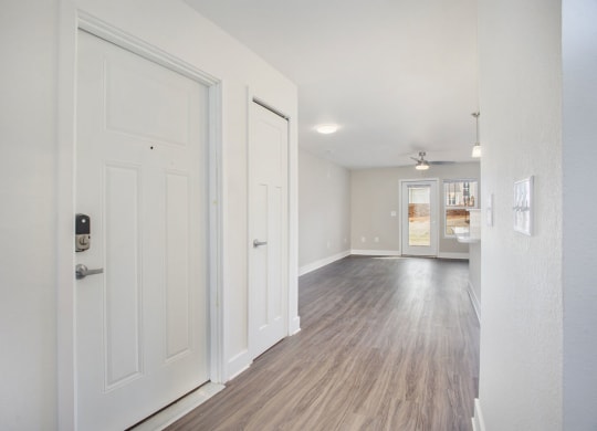 Hallway leading to living room with wood floors  at Signature Pointe Apartment Homes, Athens