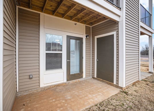 Patio with a door to enclosed storage  at Signature Pointe Apartment Homes, Athens, AL, 35611