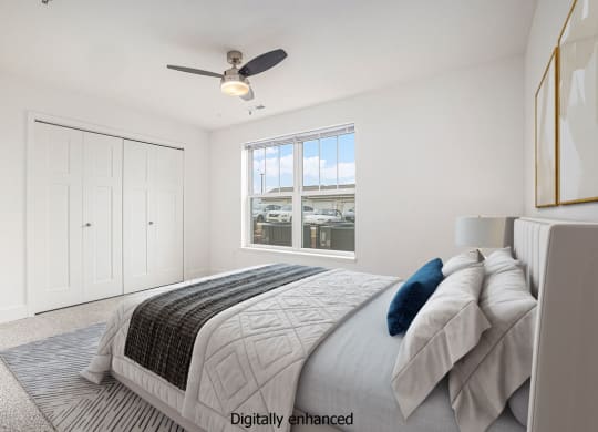 Bedroom with ceiling fan at Signature Pointe Apartment Homes in Athens, AL
