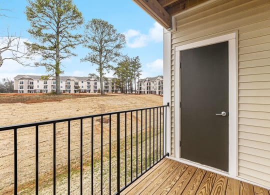 a door on a balcony with enclosed storage  at Signature Pointe Apartment Homes, Athens