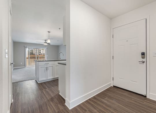 Entry to kitchen and living room with hard surface floors  at Signature Pointe Apartment Homes, Alabama