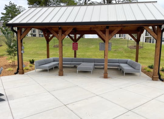 oversized covered seating area near the pool at Signature Pointe Apartment Homes in Athens, AL