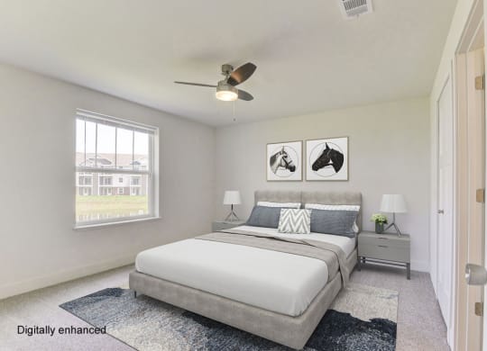 a bedroom with a bed and a ceiling fan  at Signature Pointe Apartment Homes, Alabama, 35611