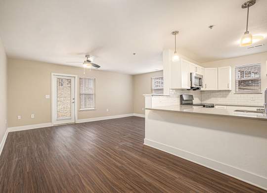 An entryway into the kitchen and enlarged living room at Signature Pointe Apartment Homes, Athens, 35611