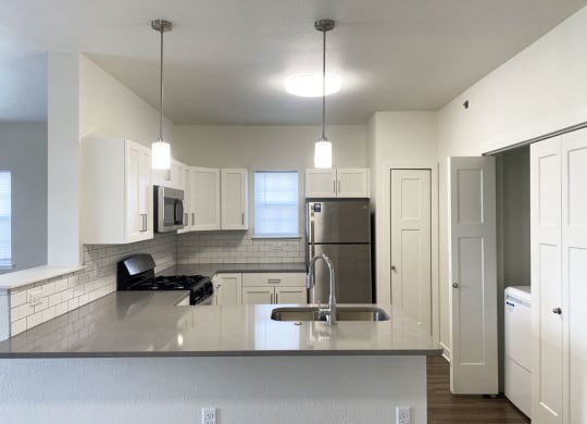 an end style kitchen with a window at Stoney Pointe Apartment Homes, Wichita, Kansas