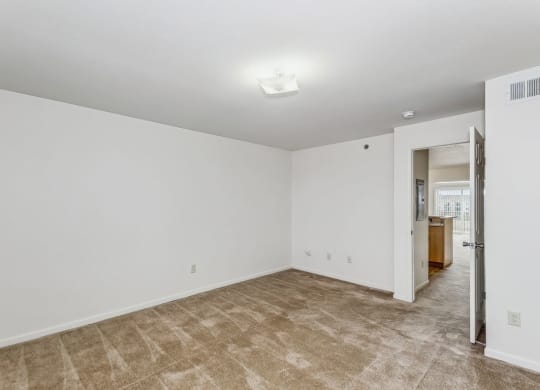 Spacious Bedroom with Plush Carpeting at Stoney Pointe Apartment Homes in Wichita, KS