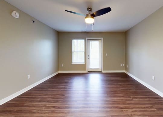 living room with hard-surface floors and a ceiling fan at Strathmore Apartment Homes, West Des Moines, 50266