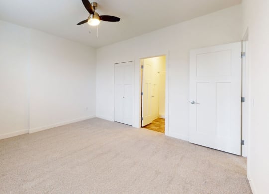 a bedroom with walk-in closet and second bathroom at Strathmore Apartment Homes, West Des Moines, 50266