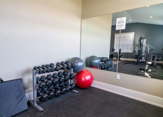 Free Weights In Gym at Strathmore Apartment Homes, West Des Moines, IA
