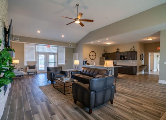 Posh Lounge Area With Fireplace In Clubhouse at Strathmore Apartment Homes, West Des Moines, Iowa