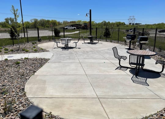 Grilling Area With Seating at Strathmore Apartment Homes, West Des Moines
