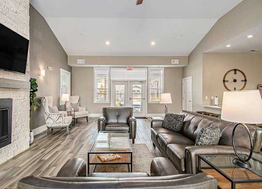 Posh Lounge Area With Fireplace In Clubhouse at Strathmore Apartment Homes, West Des Moines, Iowa