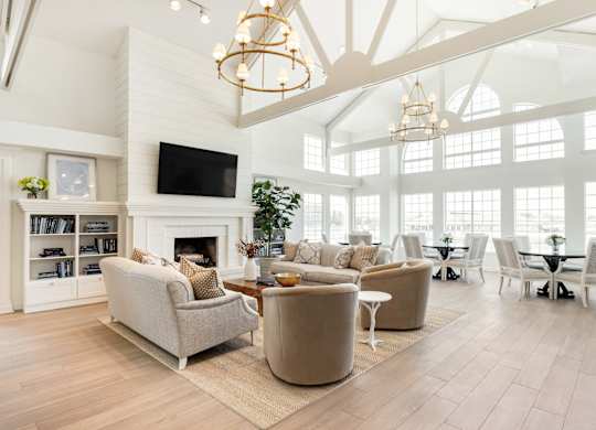 A living room with a fireplace and a television. at Sundance Apartments, Indianapolis, IN