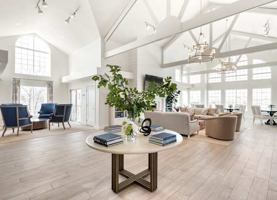A spacious room with a round table in the center and chairs surrounding it. at Sundance Apartments, Indianapolis, 46237