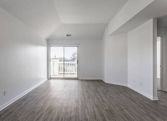 A room with a slanted ceiling and a large window. at Sundance Apartments, Indianapolis, 46237