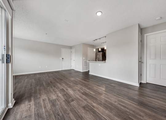 A room with wooden floors and white walls. at Sunscape Apartments, Roanoke, VA, 24018