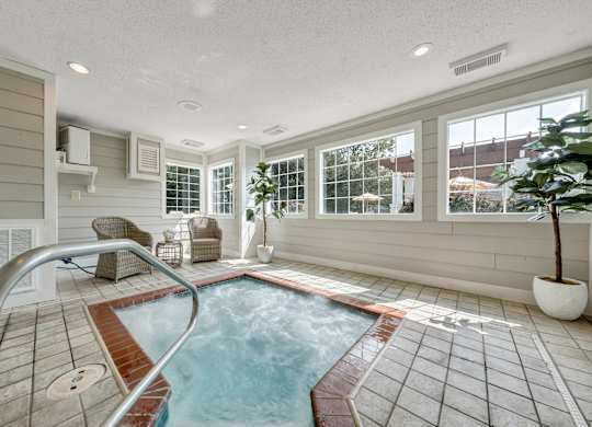 A small indoor pool with a metal ladder. at Sunscape Apartments, Virginia, 24018