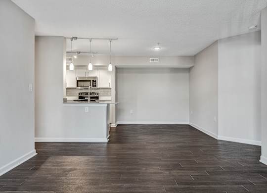 A kitchen area with a counter and a microwave. at Sunscape Apartments, Roanoke, VA, 24018