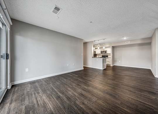 A room with wooden floors and white walls. at Sunscape Apartments, Virginia, 24018