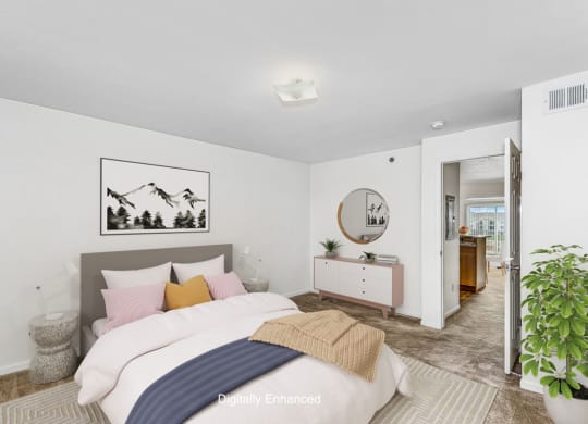 a bedroom with a bed and a mirror and a closet at Tall Oaks Apartment Homes, Michigan