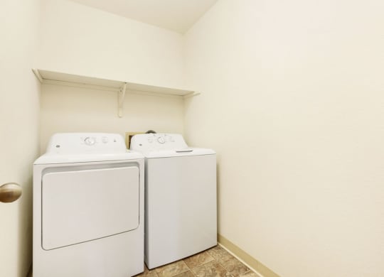a laundry room with a washer and dryer in it at Tanglewood Apartments, Oak Creek, WI, 53154