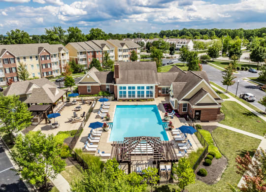 an aerial view of the resort style pool with lounge chairs around it at The Avenue at Polaris Apartments, Ohio