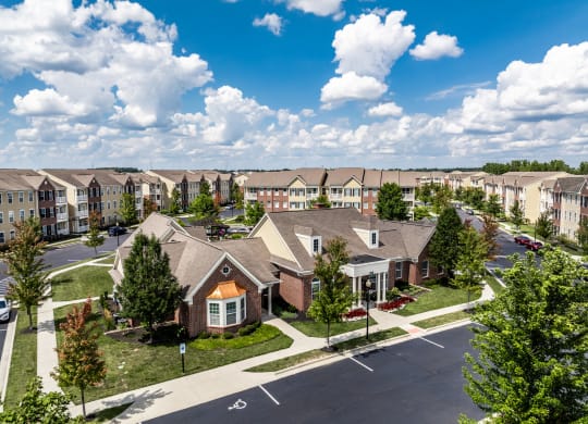 an aerial view of a community with houses and trees at The Avenue at Polaris Apartments, Ohio
