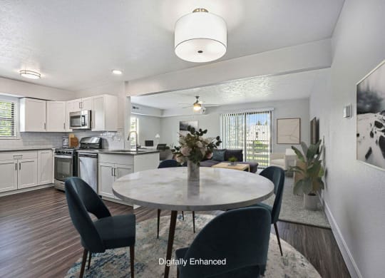 an open kitchen and dining room with hard surface floors at The Crossings Apartments, Michigan, 49508