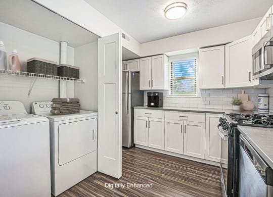 kitchen with white cabinets and stainless steel appliances at The Crossings Apartments, Michigan, 49508