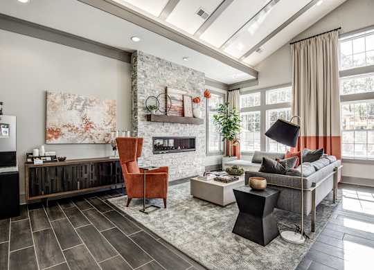 A modern living room with a fireplace and a large painting on the wall at The Retreat Apartments, Roanoke, 24019
