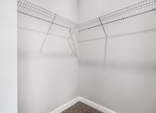 A wire shelf is mounted on a white wall at The Retreat Apartments, Roanoke, 24019