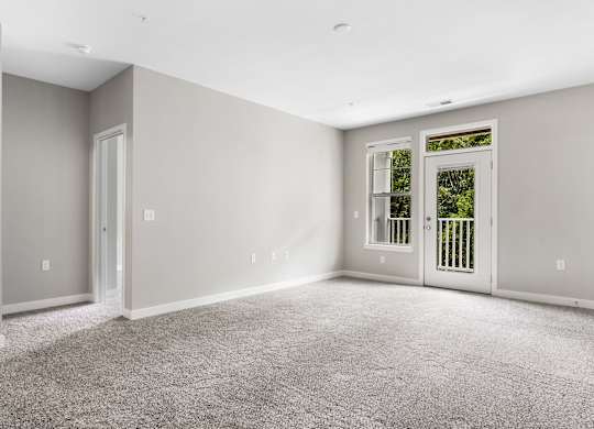 A room with grey carpet and white walls at The Retreat Apartments, Roanoke, 24019