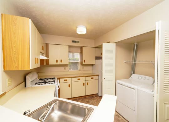 End Style Kitchen with Window at The Highlands Apartments in Elkhart, IN