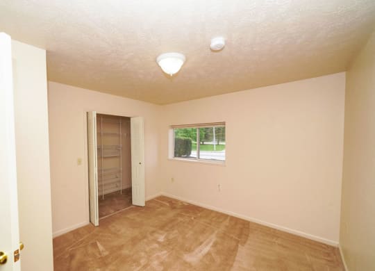 Bedroom with Walk In Closet at The Highlands Apartments in Elkhart, IN