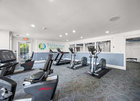 A gym with treadmills and elliptical machinesk at Timberlane Apartments, Peoria, Illinois