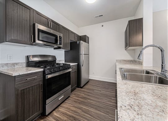 a kitchen with stainless steel appliances at Trade Winds Apartment Homes, Elkhorn, NE
