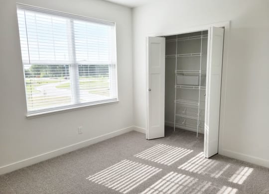 Bedroom with Large Windows with Lots of Natural Light at Trade Winds Apartment Homes, Elkhorn, NE