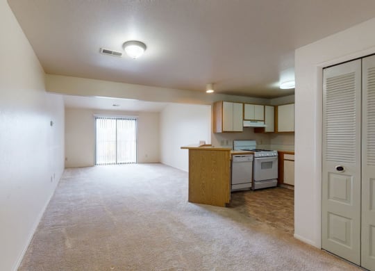 large living/dining areas and kitchen with breakfast bar  at Trappers Cove Apartments, Lansing, MI, 48910