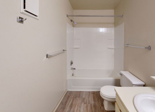 a bathroom with a sink toilet and a shower  at Trappers Cove Apartments, Lansing, Michigan