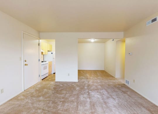 living room and dining room with breakfast bar at Trappers Cove Apartments, Lansing, Michigan