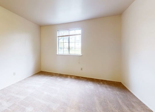 second bedroom with a window  at Trappers Cove Apartments, Lansing, MI, 48910