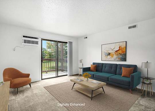 A living room with a couch, a brown chair, and a painting on the wall at Trappers Cove Apartments, Michigan, 48910