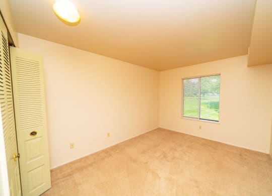 Large Comfortable Bedrooms With Closets at Trappers Cove Apartments, Lansing, MI, 48910