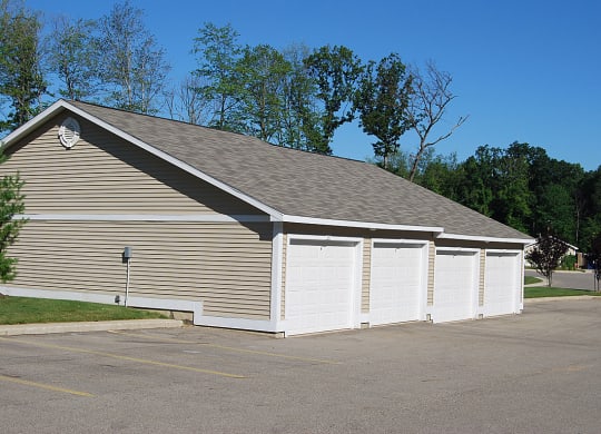 Detached Garages with Remote Openers at Trillium Pointe Apartment Homes, Jackson